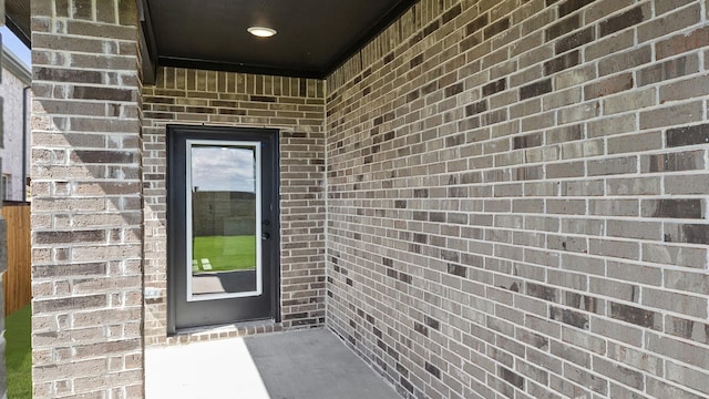 724 Hidden Feather, Lavon, TX 75166 - doorway to property featuring brick siding