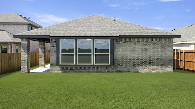 724 Hidden Feather, Lavon, TX 75166 - back of house with a shingled roof, a fenced backyard, and brick siding