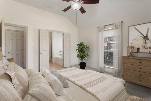 bedroom with baseboards, vaulted ceiling, ensuite bathroom, visible vents, and ceiling fan