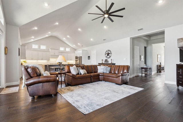 living room with dark wood-style flooring, visible vents, high vaulted ceiling, and ceiling fan