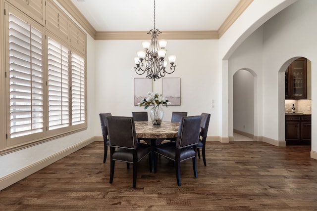 771 Hayden Rd, Lantana, TX 76226 - dining area with arched walkways, plenty of natural light, dark wood finished floors, a chandelier, and ornamental molding