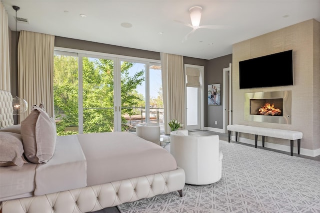 bedroom with a fireplace, visible vents, and baseboards