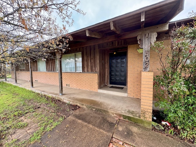 TBA N Oakridge Dr, Hudson Oaks, TX 76087 - view of exterior entry featuring brick siding