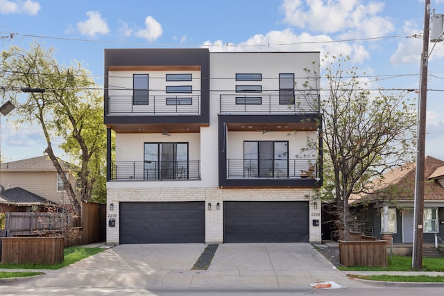 2228 Wycliff Ave, Dallas, TX 75219 - contemporary home with a balcony, fence, a garage, stucco siding, and driveway