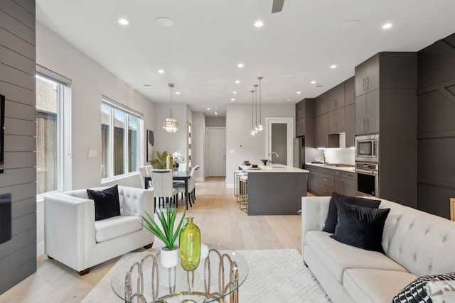 2228 Wycliff Ave, Dallas, TX 75219 - living area featuring a ceiling fan, light wood-style flooring, and recessed lighting