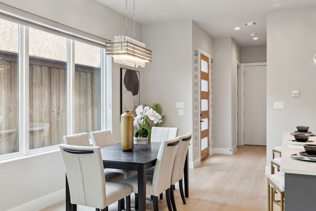 2228 Wycliff Ave, Dallas, TX 75219 - dining area featuring baseboards, recessed lighting, visible vents, and light wood-style floors