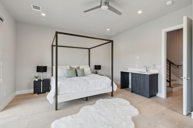 2228 Wycliff Ave, Dallas, TX 75219 - bedroom with recessed lighting, baseboards, a sink, light wood-style floors, and visible vents