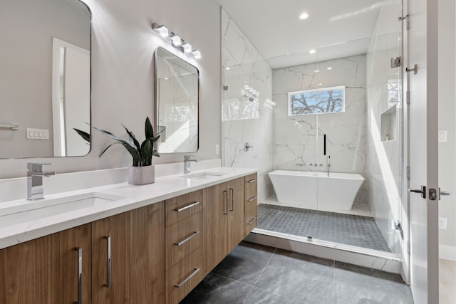 2228 Wycliff Ave, Dallas, TX 75219 - bathroom with a soaking tub, double vanity, a sink, and tile patterned flooring