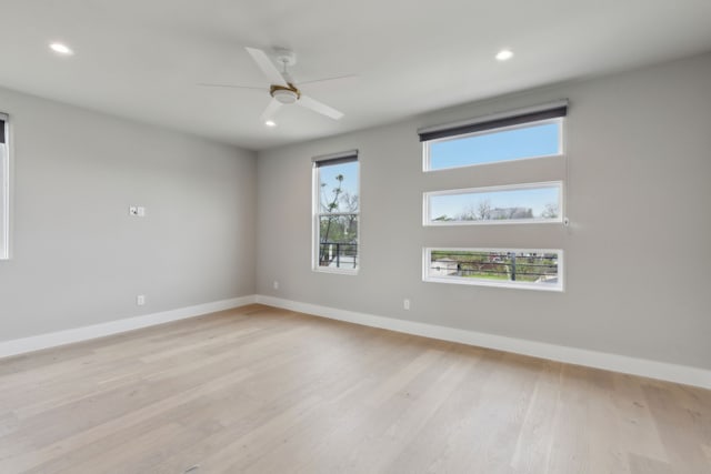 2228 Wycliff Ave, Dallas, TX 75219 - empty room featuring baseboards, ceiling fan, and light wood-type flooring