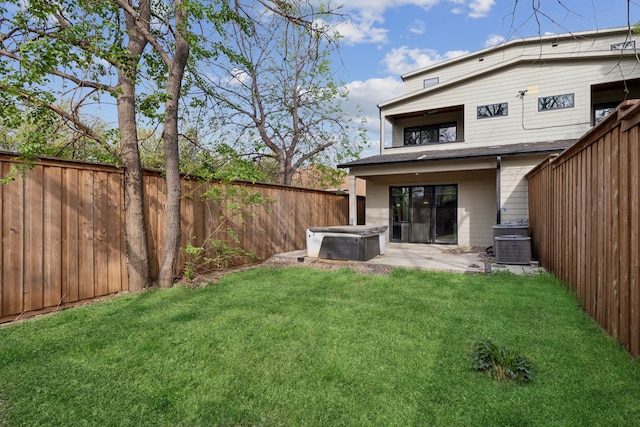 2228 Wycliff Ave, Dallas, TX 75219 - view of yard with a hot tub, central air condition unit, a fenced backyard, and a patio