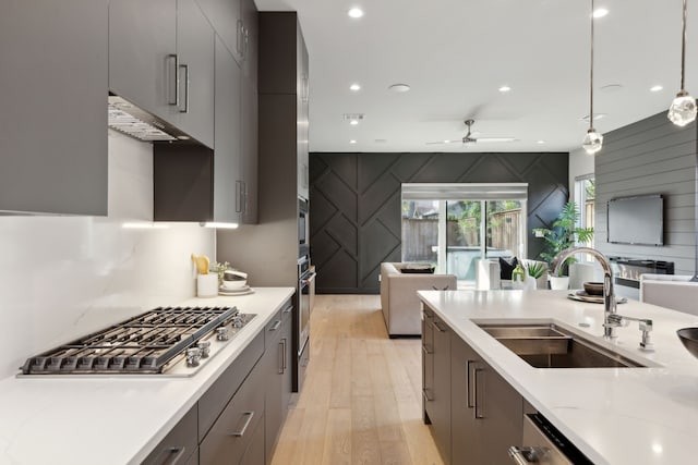 2228 Wycliff Ave, Dallas, TX 75219 - kitchen with modern cabinets, open floor plan, a sink, and stainless steel appliances