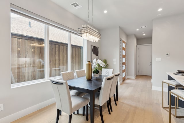 2228 Wycliff Ave, Dallas, TX 75219 - dining space with baseboards, visible vents, and light wood-style floors