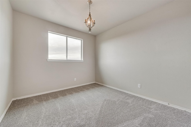 119 Valen Dr, Fate, TX 75189 - spare room featuring carpet floors, a notable chandelier, and baseboards