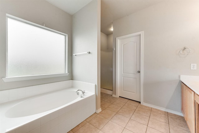 119 Valen Dr, Fate, TX 75189 - bathroom featuring tile patterned flooring, vanity, baseboards, a shower stall, and a bath