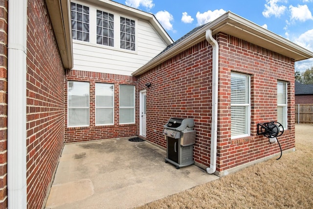 104 Cambridge Ct, Heath, TX 75032 - view of side of home featuring brick siding and a patio area