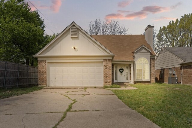 1029 Danforth Ct, Arlington, TX 76017 - view of front of home with concrete driveway, brick siding, a garage, and a yard