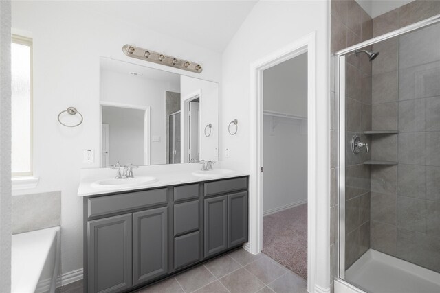 5401 Overbrook Dr, Denton, TX 76207 - bathroom with double vanity, a sink, a stall shower, and tile patterned flooring