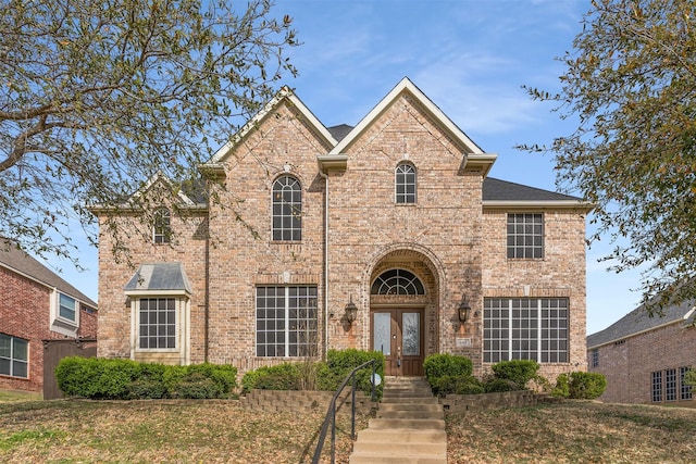 view of front of property featuring brick siding
