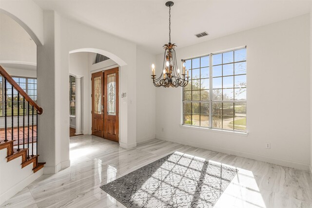 1417 Shadow Brook Trl, Garland, TX 75043 - living area with baseboards, dark wood-style flooring, french doors, and arched walkways