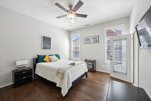 2937 Lago Vista Ln, Rockwall, TX 75032 - bedroom featuring wood finished floors, baseboards, and a ceiling fan