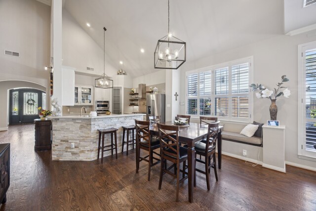 2937 Lago Vista Ln, Rockwall, TX 75032 - dining room with a chandelier, dark wood-style floors, baseboards, recessed lighting, and plenty of natural light