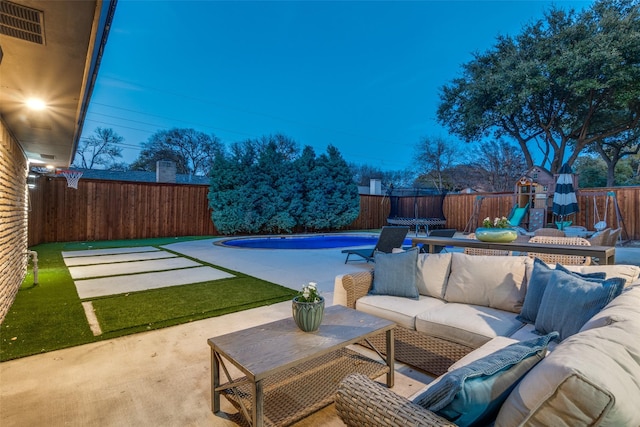 4055 Fawnhollow Dr, Dallas, TX 75244 - fenced backyard with an outdoor hangout area, a patio, and a playground