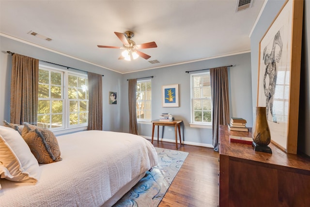 6722 Lakewood Blvd, Dallas, TX 75214 - bedroom featuring visible vents, crown molding, and wood finished floors