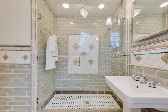 6722 Lakewood Blvd, Dallas, TX 75214 - full bath with a sink, tile walls, and a shower stall