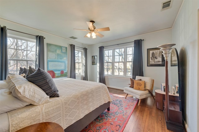 6722 Lakewood Blvd, Dallas, TX 75214 - bedroom featuring a ceiling fan, wood finished floors, baseboards, and visible vents