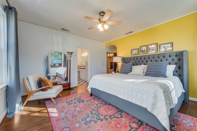 6722 Lakewood Blvd, Dallas, TX 75214 - bedroom featuring visible vents, wood finished floors, arched walkways, and a ceiling fan