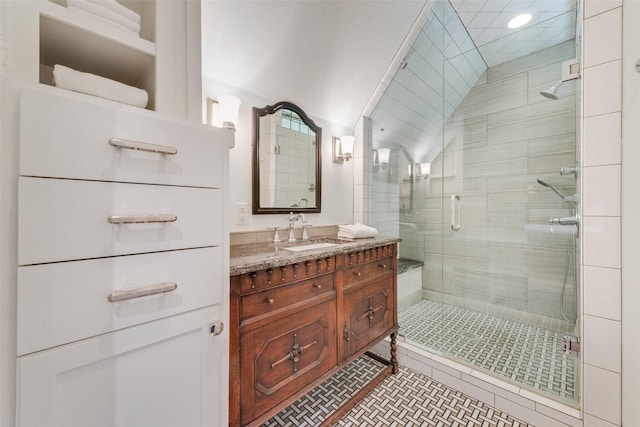 6722 Lakewood Blvd, Dallas, TX 75214 - bathroom with a stall shower, vaulted ceiling, and vanity