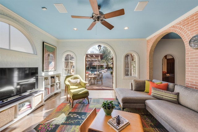 6722 Lakewood Blvd, Dallas, TX 75214 - living area with tile patterned floors, ornamental molding, brick wall, and a ceiling fan