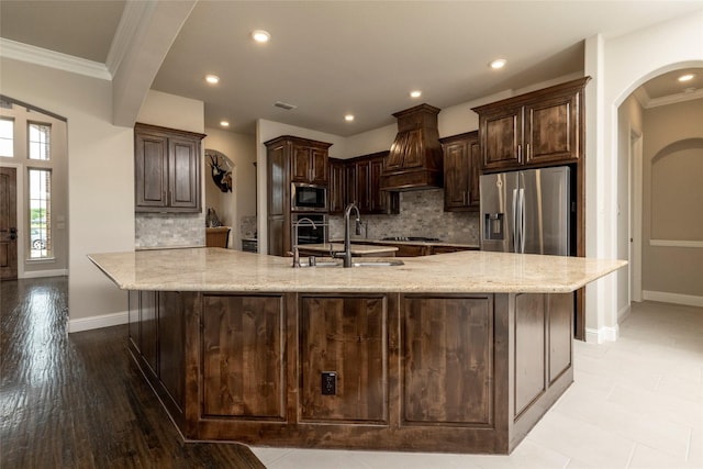 1413 Artesia Ln, Mclendon Chisholm, TX 75032 - kitchen featuring crown molding, custom exhaust hood, dark brown cabinetry, a sink, and stainless steel appliances