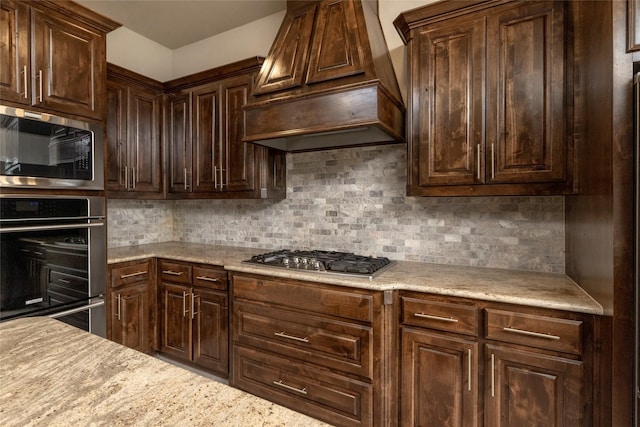 1413 Artesia Ln, Mclendon Chisholm, TX 75032 - kitchen featuring light countertops, decorative backsplash, appliances with stainless steel finishes, and custom exhaust hood