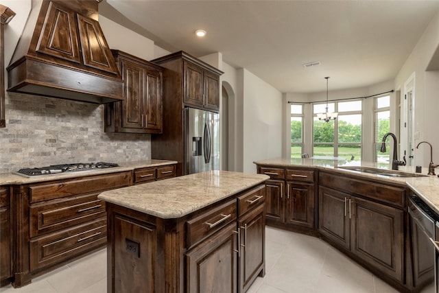 1413 Artesia Ln, Mclendon Chisholm, TX 75032 - kitchen with light tile patterned flooring, appliances with stainless steel finishes, a sink, premium range hood, and backsplash