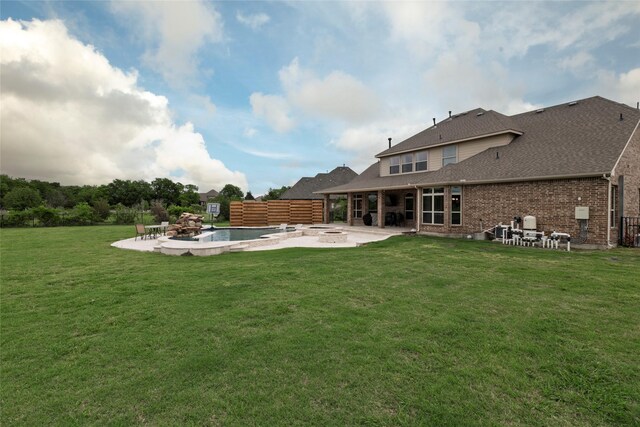 1413 Artesia Ln, Mclendon Chisholm, TX 75032 - back of property featuring a patio, a yard, a fire pit, and brick siding
