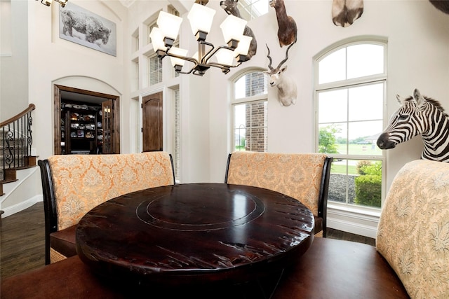 1413 Artesia Ln, Mclendon Chisholm, TX 75032 - dining room with dark wood finished floors, stairs, a notable chandelier, and a wealth of natural light