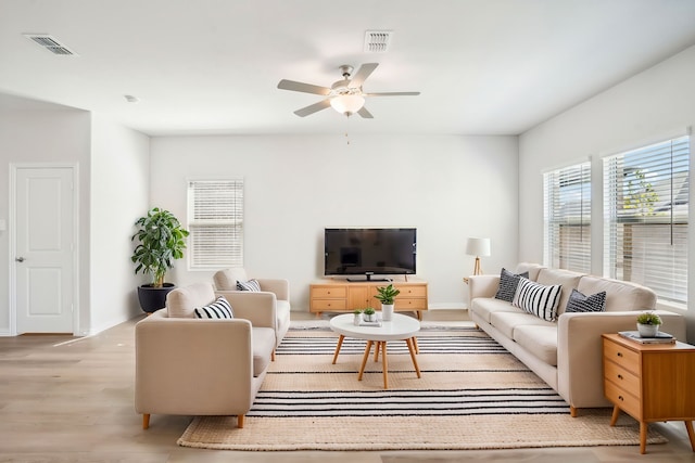 3910 Walmer Way, Princeton, TX 75071 - living area featuring a ceiling fan, light wood-style flooring, and baseboards