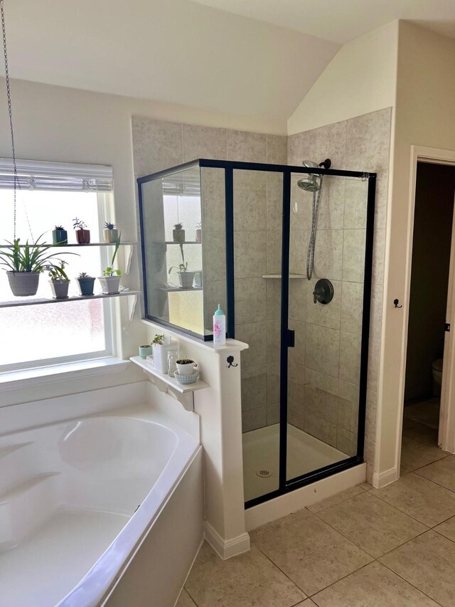 412 Lake St, Red Oak, TX 75154 - bathroom featuring a shower stall, tile patterned floors, a bath, and lofted ceiling