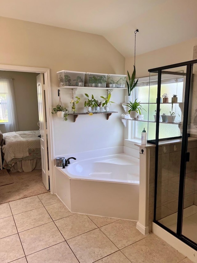 412 Lake St, Red Oak, TX 75154 - full bathroom with ensuite bathroom, a garden tub, tile patterned floors, a shower stall, and lofted ceiling