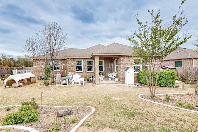 412 Lake St, Red Oak, TX 75154 - rear view of house with brick siding, a fenced backyard, a patio, and roof with shingles
