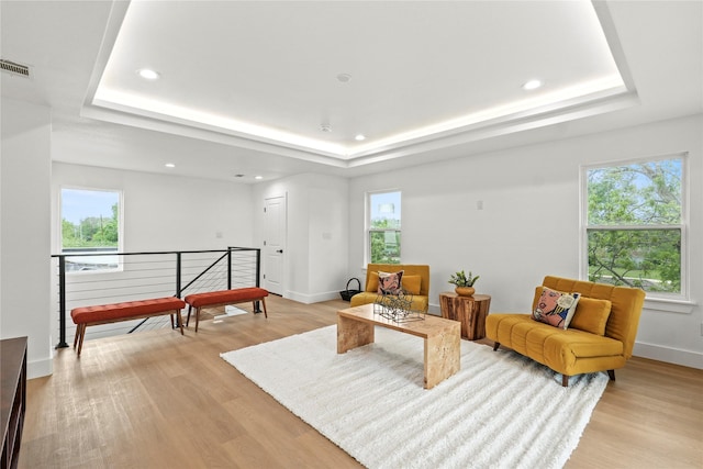 221 S Henderson Ave, Dallas, TX 75214 - living room featuring a tray ceiling, light wood-style flooring, baseboards, and recessed lighting
