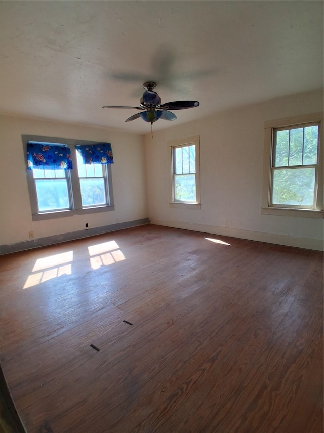 208 E 4th St, Coleman, TX 76834 - spare room featuring baseboards, ceiling fan, and wood finished floors