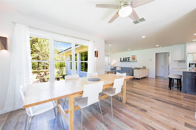 dining space with light wood-style floors, ceiling fan, visible vents, and recessed lighting