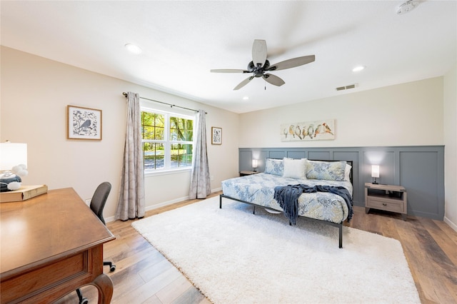 bedroom featuring visible vents, baseboards, ceiling fan, light wood-style floors, and recessed lighting