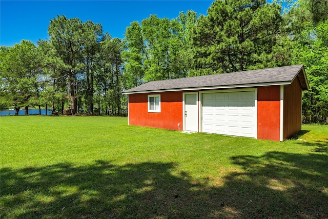 detached garage with a water view