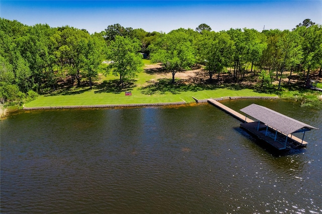 view of dock featuring a yard and a water view