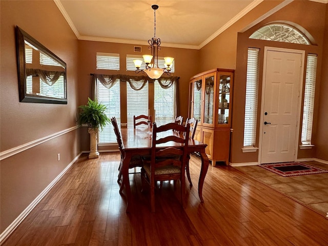 2610 Jakes Ct, Midlothian, TX 76065 - dining space with a chandelier, dark wood finished floors, crown molding, and baseboards