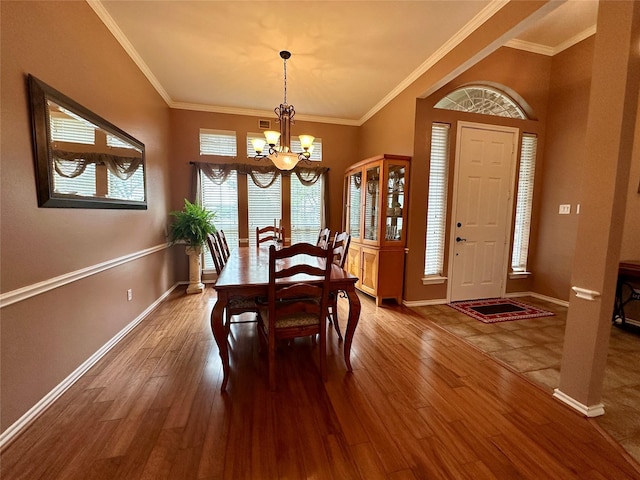 2610 Jakes Ct, Midlothian, TX 76065 - dining area with a chandelier, wood finished floors, baseboards, and ornamental molding
