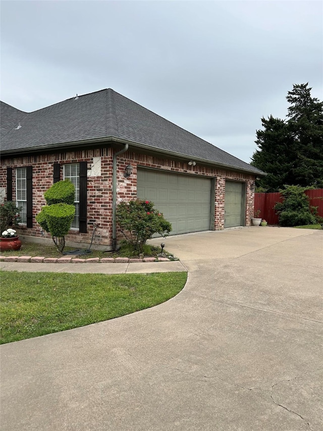 2610 Jakes Ct, Midlothian, TX 76065 - view of front of property with roof with shingles, a garage, and brick siding